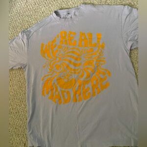 Oversized lavender and yellow graphic tee from H&M. “We’re all mad here”